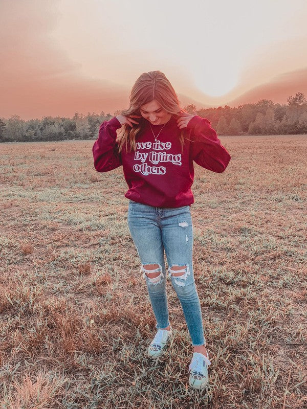 Ask Apparel We Rise By Lifting Others Sweatshirt